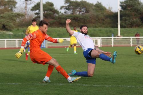 IMG 0310-Josh-Strizovic-clears-from-Jake-Cass-who-wasnt-as-close-to-the-ball-as-the-picture-might-suggest