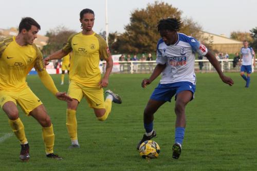 IMG 0376-Herne-Bays-Dan-Johnson-L-and-Che-Krabbendam-try-to-keep-Andre-Coker-under-control