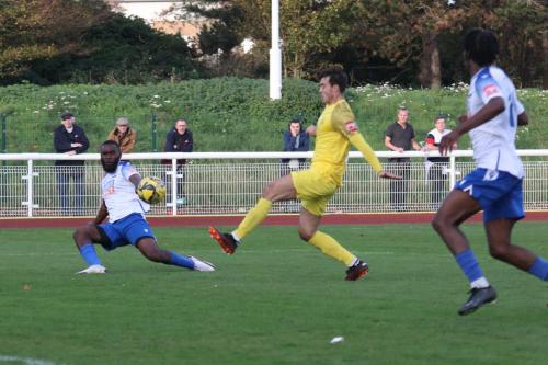 IMG 0381-Dan-Johnson-centre-blocks-Juevan-Spencers-cross-beofre-it-can-reach-Andre-Coker