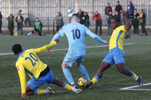 IMG 2432-Enfields-Marcus-Wyllie-lays-the-ball-back-under-pressure-from-William-Dupray-L-and-Olu-Durojaiye