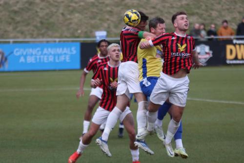 IMG 6085-Enfields-Adam-Cunnington-is-closely-marked-by-Alfie-Young-R-and-Tom-Champion