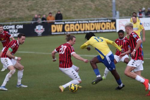 IMG 6104-Andre-Coker-tries-to-wriggle-through-the-Lewes-defence