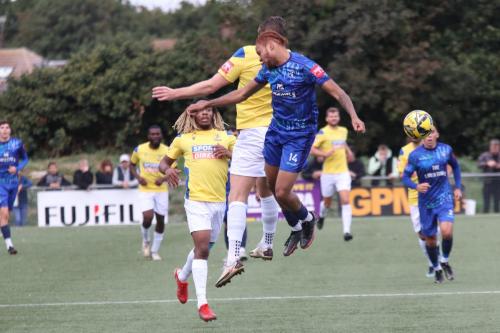 IMG 7947-Enfields-Adam-Cunnington-wins-a-header-against-Peter-Ojemen