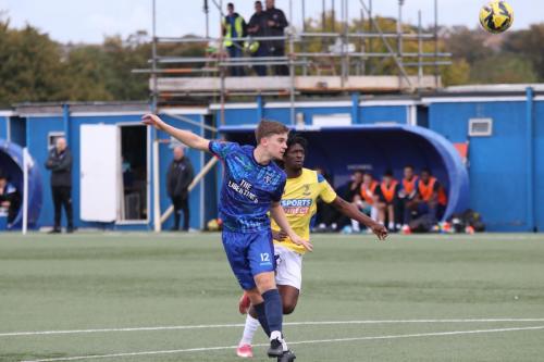 IMG 7981-Margates-Freddy-Barton-heads-the-ball-aheead-of-Andre-Coker