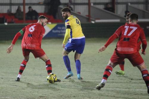 IMG 3907-Jake-Cass-flicks-the-ball-between-James-Gurteen-L-and-Harry-Gallagher