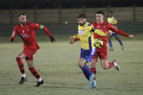 IMG 3934-Jake-Cass-earns-a-yellow-card-for-handball.-Or-possibly-for-arguing-with-the-decision.