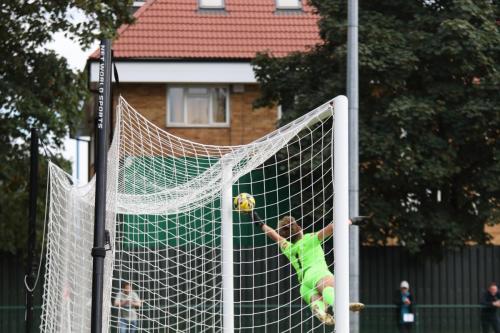 IMG 7137-Potter-Bars-Ted-Collins-turns-Lyle-Della-Verdes-free-kick-onto-the-post-but-the-ball-bounces-out-and-spins-back-into-the-net