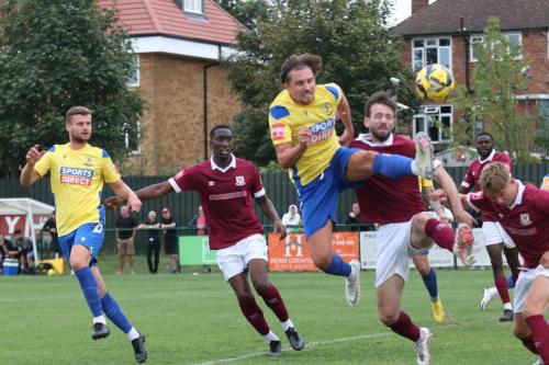 IMG 7294-Enfields-Sam-Youngs-attacks-the-ball-under-challenge-from-Calvin-Dickson