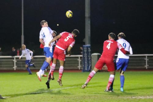 IMG 6937-Adam-Cunnington-L-challenges-Rickie-Hayles-Hornchurch-keeper-Joe-Wright-watches-as-a-free-kick-is-just-too-high