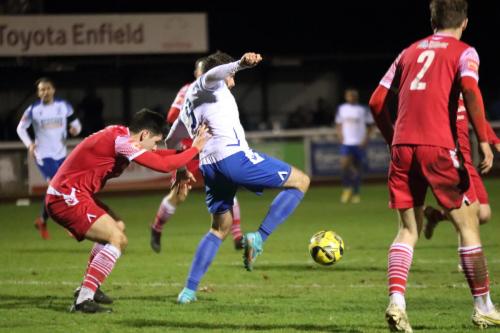 IMG 7160-Jake-Cass-lays-the-ball-off-under-pressure-from-Joe-Christou