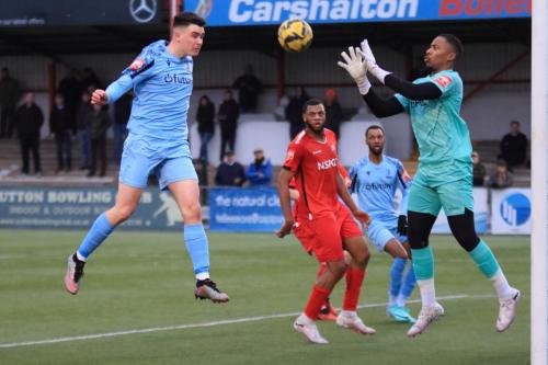 IMG 8541-Carshaltons-Aaron-Jones-just-beats-Marcus-Wyllie-to-the-ball