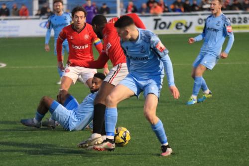 IMG 4807-Marcus-Wyllie-R-and-Alex-Brefo-challenge-for-the-ball-after-a-challenge-between-Jack-Evans-and-Reece-Beckles-Richards-on-floor