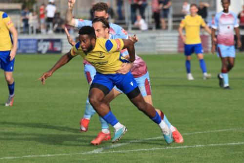 IMG 2189-Enfields-Reece-Beckles-Richards-tries-to-escape-the-grasp-of-Lewis-Rolfe