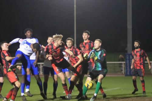 IMG 5841-Enfields-Kyle-Bailey-send-a-header-into-the-ground-and-up-onto-the-crossbar-from-where-it-rebounds-straight-to-keeper-Lewis-Greene