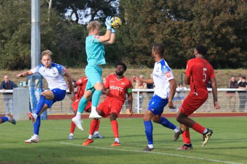 IMG 1989-Carshalton-keeper-Will-Huffer-beats-James-Richmond-L-and-Kyle-Bailey-to-a-cross