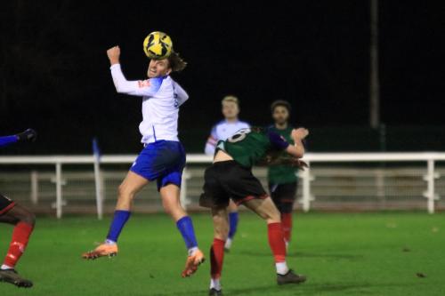 IMG 8864-Sam-Youngs-wins-a-header-against-Mark-Waters