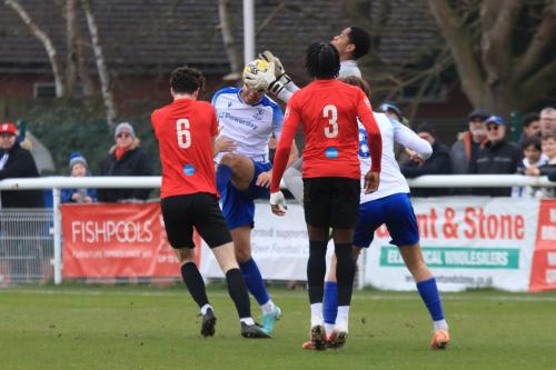 IMG 9238-Lewes-keeper-Nathan-Harvey-reaches-the-ball-just-ahead-of-Taylor-McKenzie