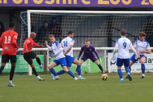 IMG 9262-One-of-Mickey-Parcell-or-Taylor-McKenzie-14-blocks-a-shot-from-Ryan-Gondoh