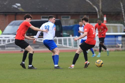 IMG 9586-Marcus-Wyllie-challenged-by-Arthur-Penney-L-and-Luke-Dreher