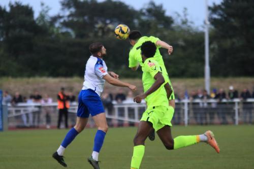 IMG 2680-Wingates-Billy-Cracknell-heads-clear-from-Jake-Cass