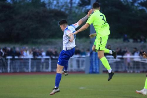 IMG 2730-Wingates-Billy-Cracknell-heads-clear-from-Marcus-Wyllie