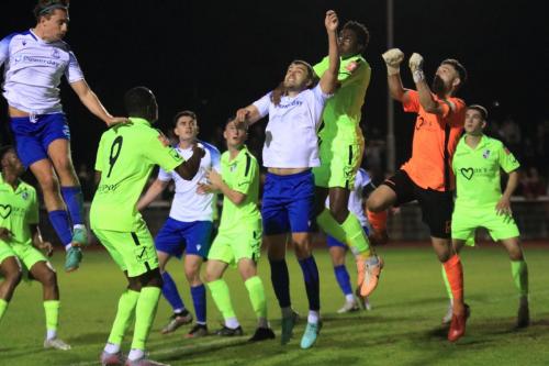 IMG 2828-Enfields-Taylor-McKenzie-centre-challenged-by-Ben-Frempah-and-goalkeeper-Ben-Goode