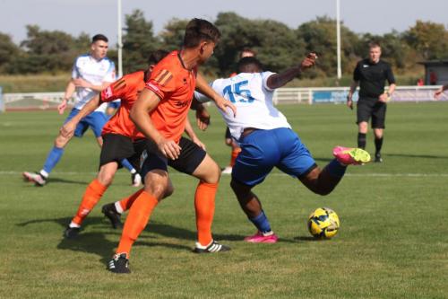 IMG 0975-Reece-Beckles-Richards-tries-to-fins-a-way-past-Craig-Robson-and-Harvey-Whyte