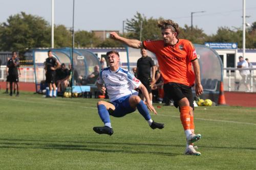 IMG 1024-Bognors-Lucas-Pattendens-late-challenge-on-Ollie-Knight-concedes-the-free-kick-from-which-Enfield-scored-their-first-goal