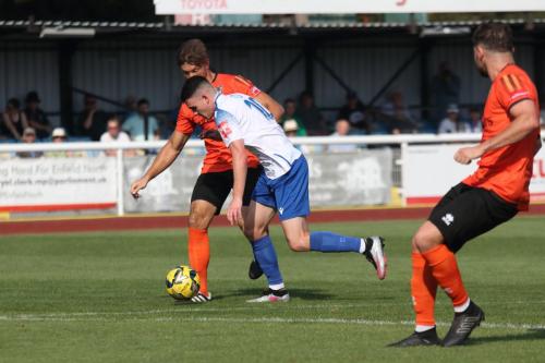 IMG 1049-Enfields-Marcus-Wyllie-is-tackled-on-the-edge-of-the-box-by-Craig-Robson