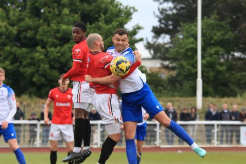 IMG 2371-Enfields-Taylor-McKenzie-challenges-Reece-Butler.-The-ball-runs-to-Ollie-Knight-to-open-the-scoring