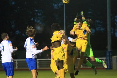 IMG 3886-Canvey-keeper-Sam-Jacksons-attempt-to-punch-clear-is-impeded-by-team-mate-Mason-Hall