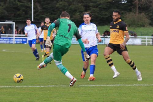 IMG 1007-Cheshunt-keeper-Woody-Williamson-scuffs-a-clearance-to-Lewis-Taaffe-on-Enfields-right-wing-who-returns-it-for-the-opening-goal