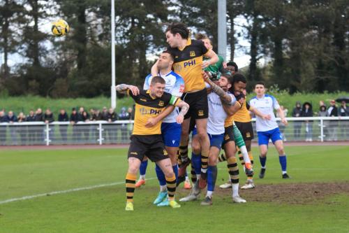 IMG 1030-Cheshunts-Alfie-Pendlebury-heads-clear-from-Taylor-McKenzie