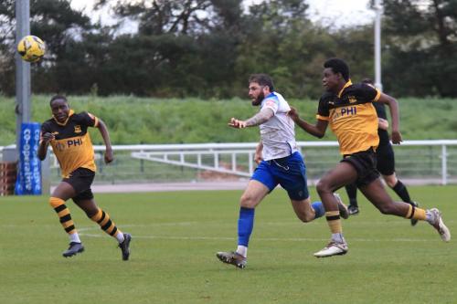 IMG 1221-Jake-Cass-tries-to-get-clear-of-Enock-Ekongo-L-and-Samuel-Kuffour