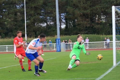 IMG 1610-Callum-Robinson-saves-from-Marcus-Wyllie-with-the-last-touch-of-the-game