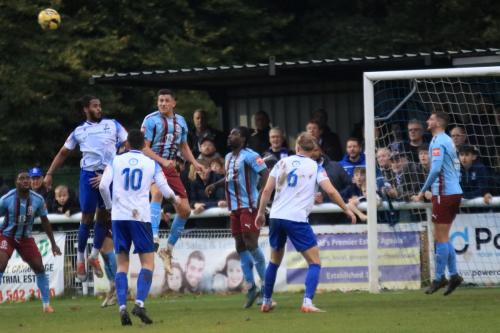 IMG 4142-Hastings-Tommy-Penfold-heads-clear-from-Joshua-Okotcha