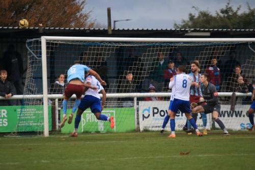 IMG 4181-Enfields-Joshua-Okotcha-heads-clear-from-Tommy-Penfold