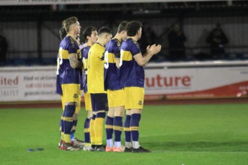 IMG 0280-The-Llantwit-Major-team-line-up-for-a-minutes-applause-in-remebrance-of-Enfields-founding-chairman-Dave-Bryant