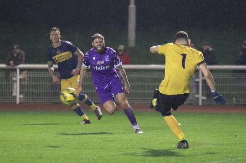 IMG 0468-Jake-Cass-tries-to-put-Ryley-Allen-off-his-clearance-kick