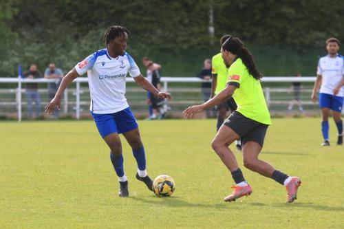IMG 2224-Emmanuel-Harvest-L-and-Ricky-Modeste.-In-the-background-Taylor-McKenzie-leaves-the-field-injured-reducing-Enfield-to-nine-men
