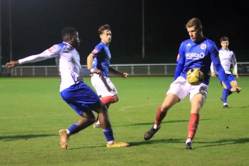 IMG 4613-Whitehawks-Joe-Tennent-survives-an-appeal-for-handball-for-his-block-of-Reece-Beckles-Richards-cross