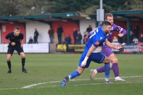 IMG 3531-Referee-Joseph-Dann-Pye-tries-to-see-through-Ollie-Muldoon-and-Mickey-Parcell
