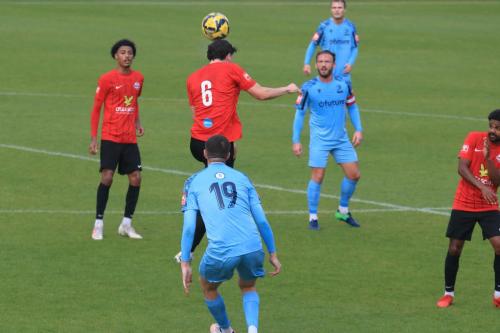 IMG 2772-Arthur-Penney-heads-the-ball-forward