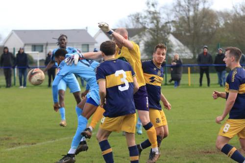 IMG 1566-Llantwit-keeper-Jack-Lansdown-challenges-Jonathan-Hippolyte