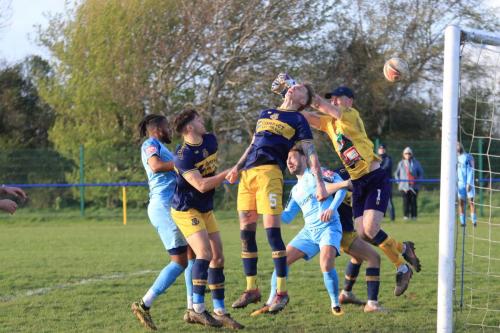 IMG 1845-Jack-Lansdown-misses-his-punch-due-either-to-the-wind-or-his-defenders-header