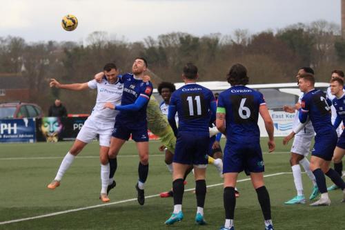 IMG 0695-Margate-keeper-Harry-Seaden-punches-clear-from-Taylor-McKenzie-L-and-Lewis-Knight
