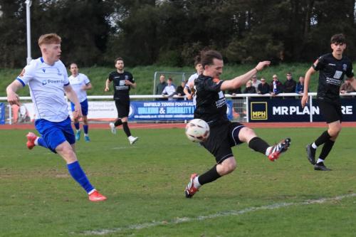 IMG 9382-Freddie-Grant-clears-a-cross-ahead-of-Cian-Dillon