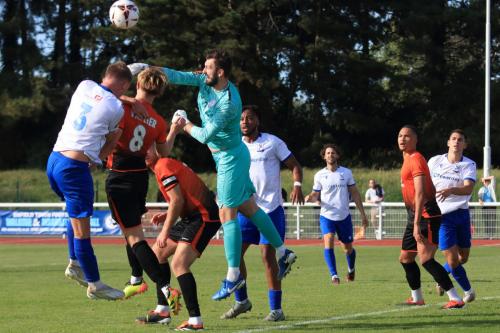 IMG 4098-Sports-keeper-Peter-Crook-punches-clear-from-Joe-Payne