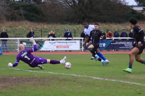 IMG 6872-Farnboroughs-Jack-Turner-dives-the-wrong-way-but-saves-Anointed-Chukwus-shot-with-his-foot