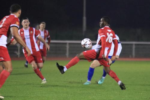 IMG 5833-Enfield-captain-Mickey-Parcell-plays-the-ball-past-emmanuel-Harvest-to-set-up-Lennon-Peakes-goal